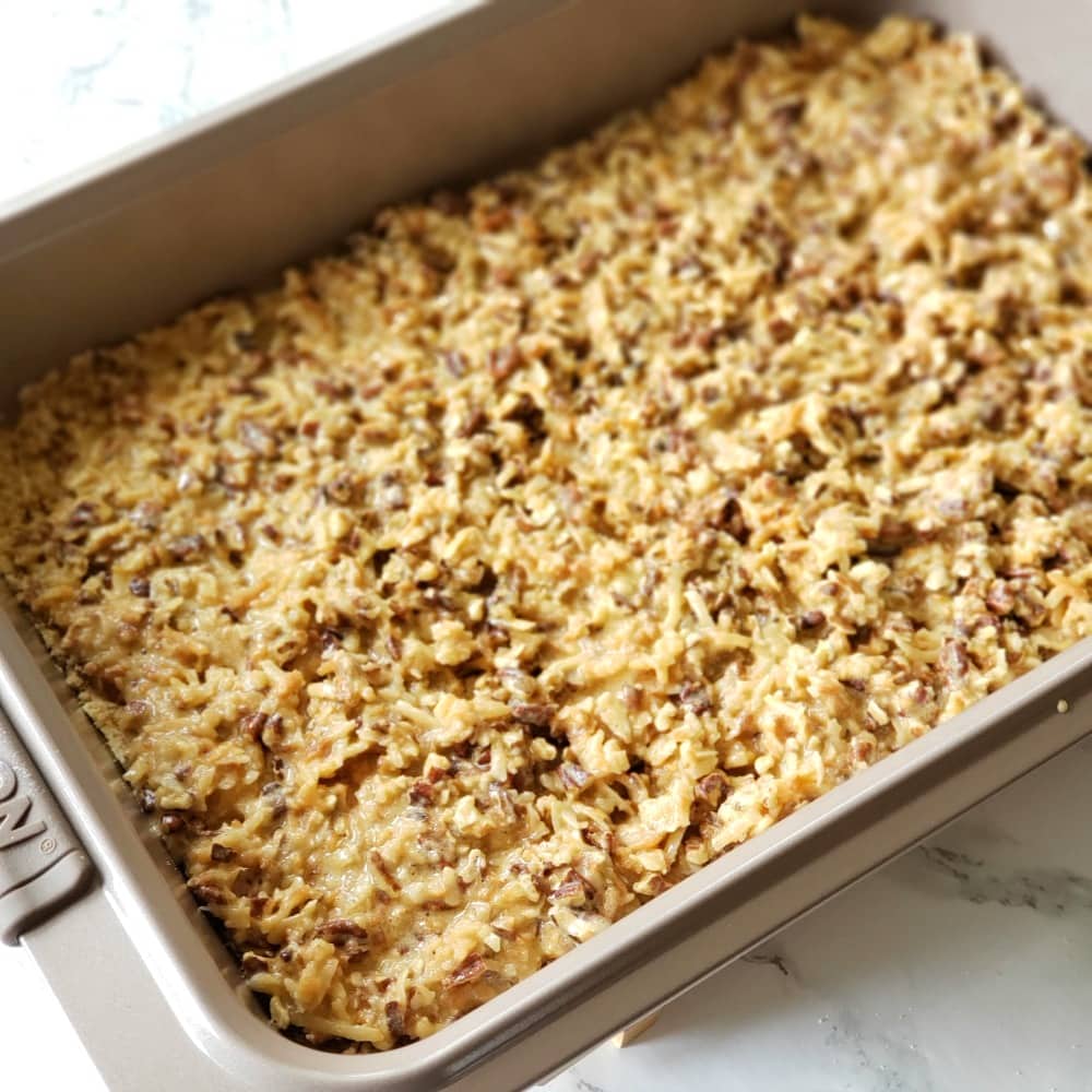 Pan of coconut bars ready to bake