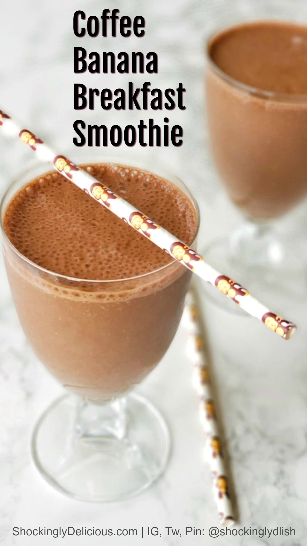 2 coffee smoothies on a white marble counter with straws