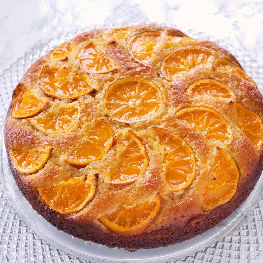 Round cake on a glass cake plate