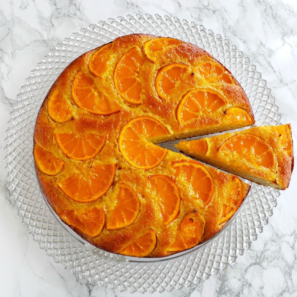 Greek Yogurt Tangerine Cake is one of the prettiest cakes around, and easiest, too! It's a simple cake made moist with yogurt and olive oil, and dressed with what turn into baked candied tangerine slices on top.