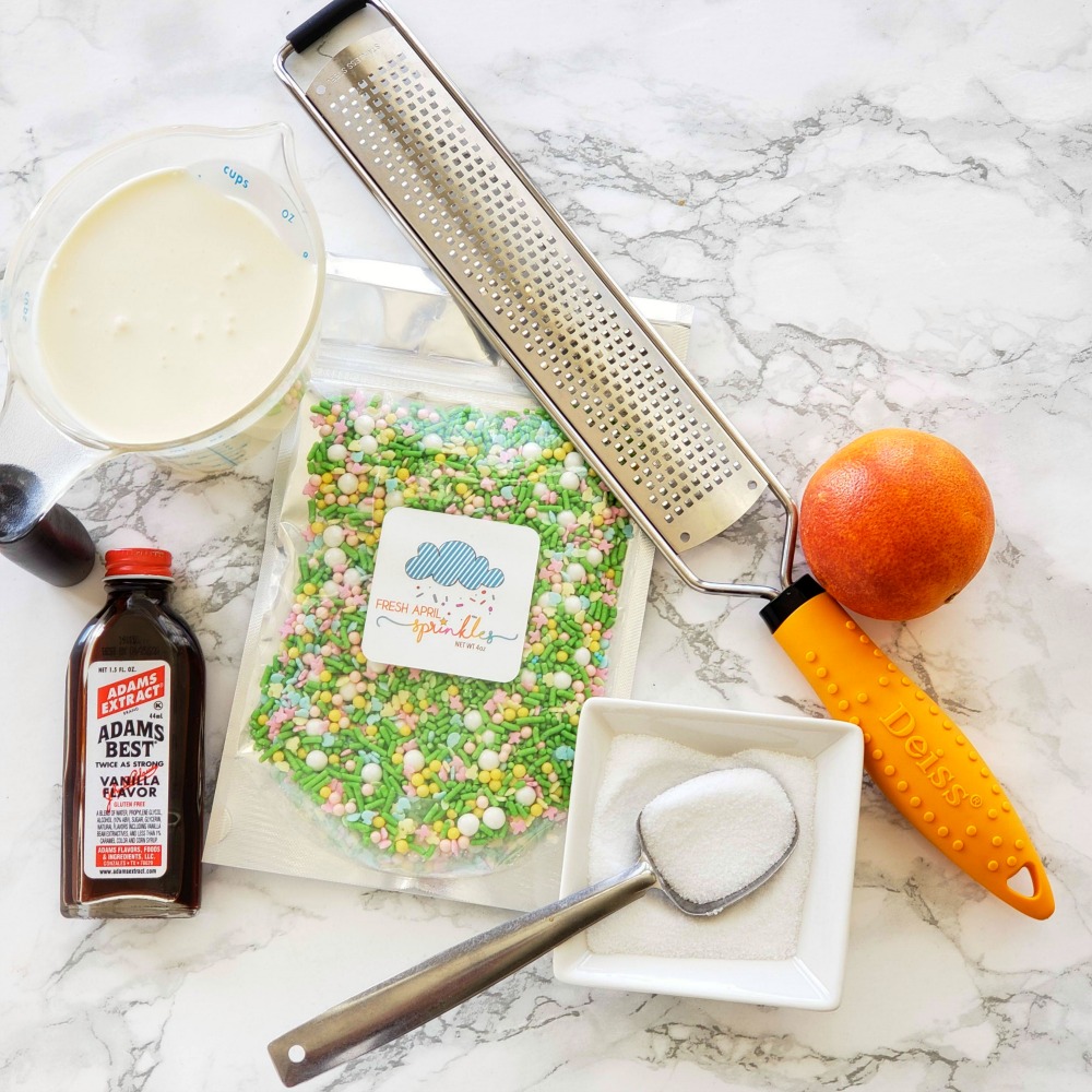 Ingredients for Orange Posset on a marble counter