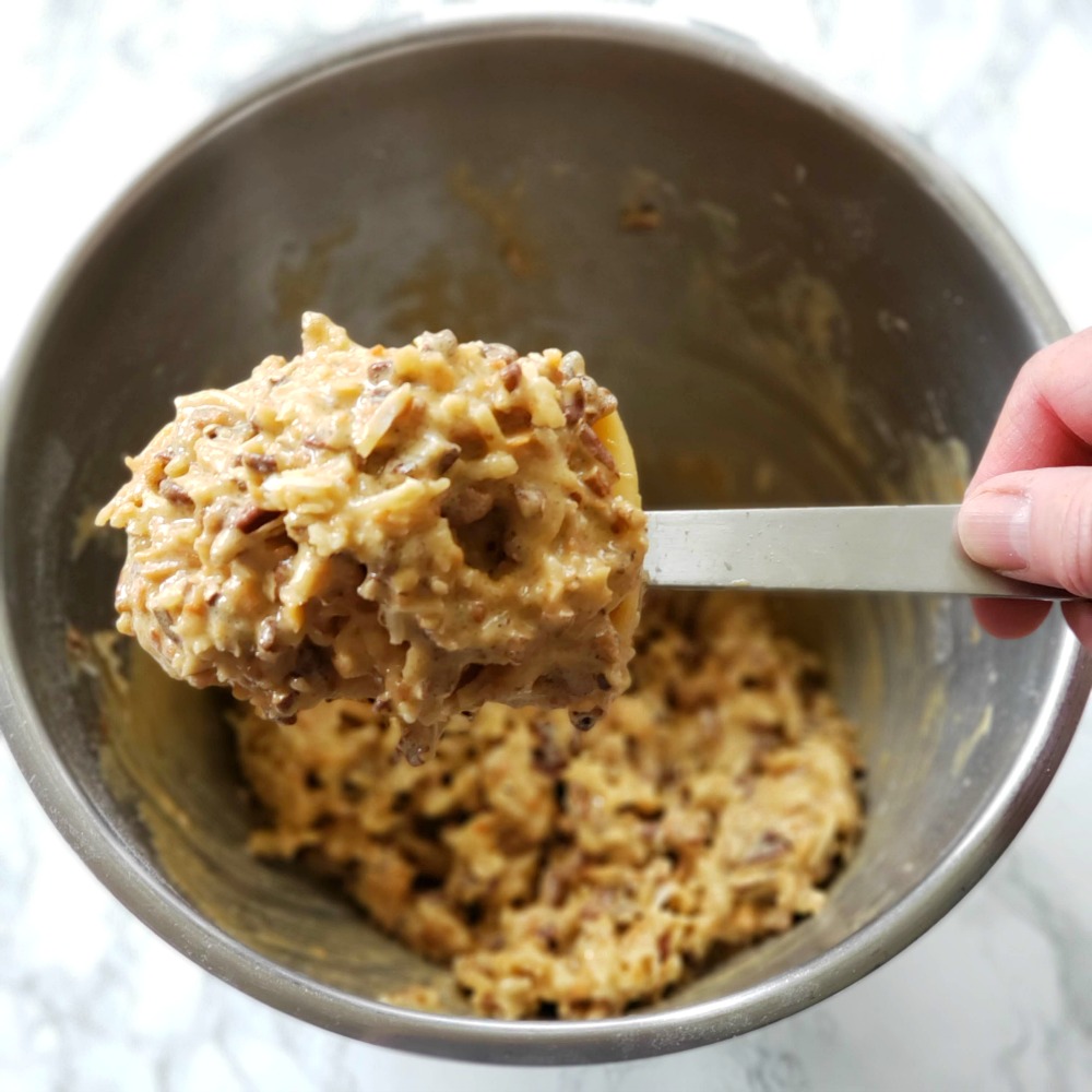 Coconut pecan filling on a big mixing spoon