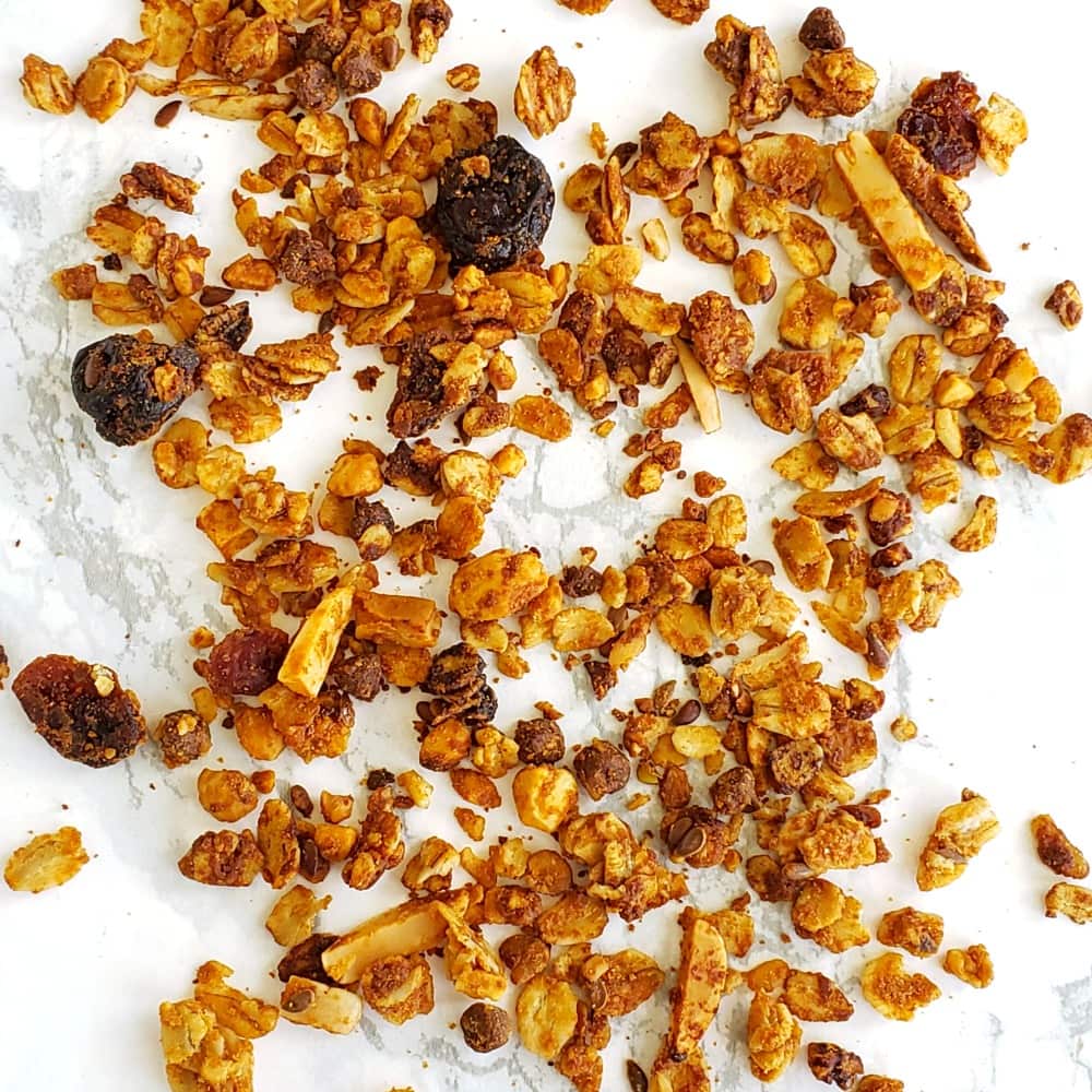 Homemade Honey Nut Granola spread out on the counter