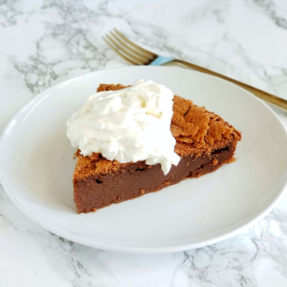 Chocolate Impossible Pie with whipped cream topping