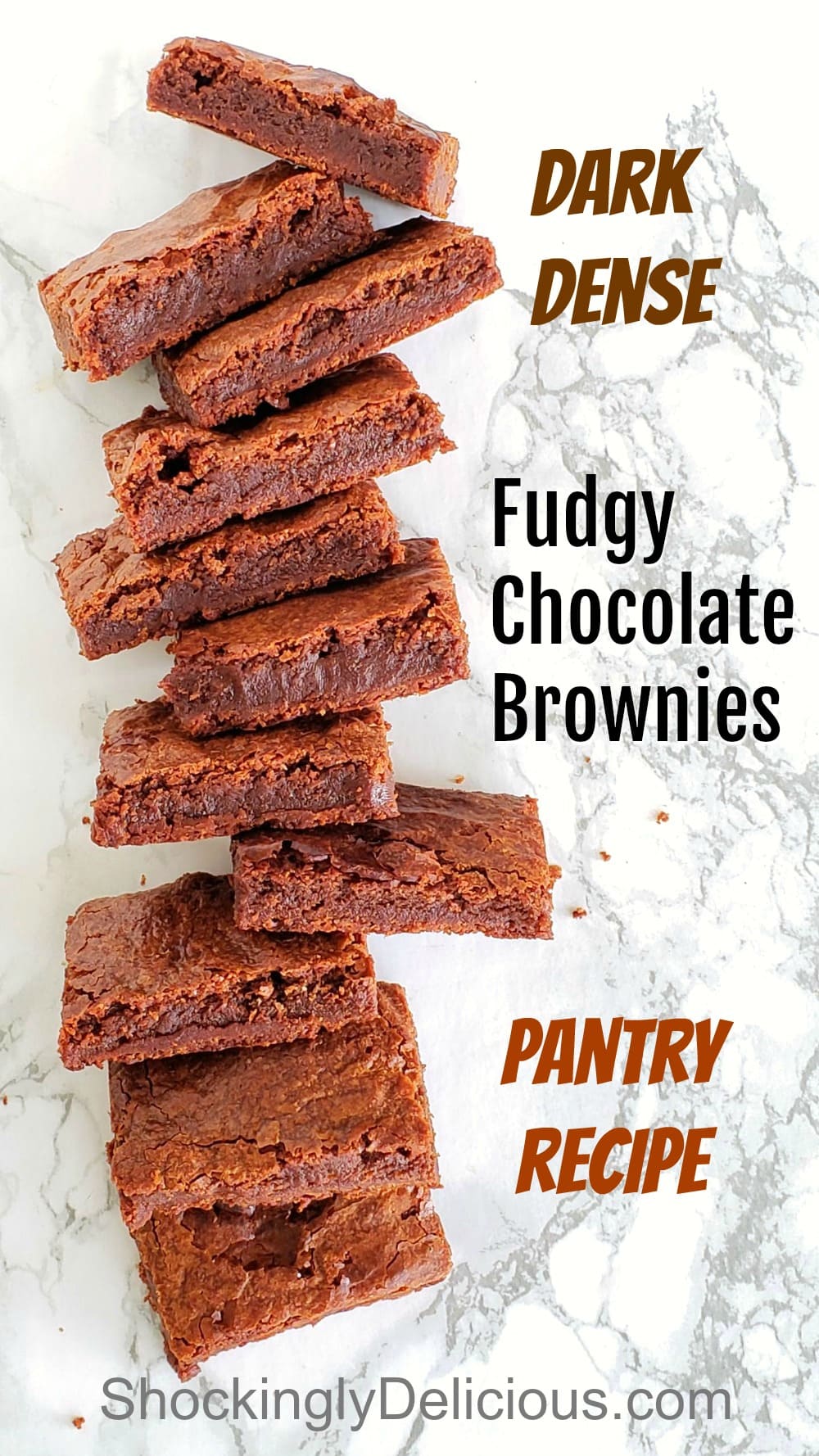 Fudgy Chocolate Brownies stacked on a marble counter top