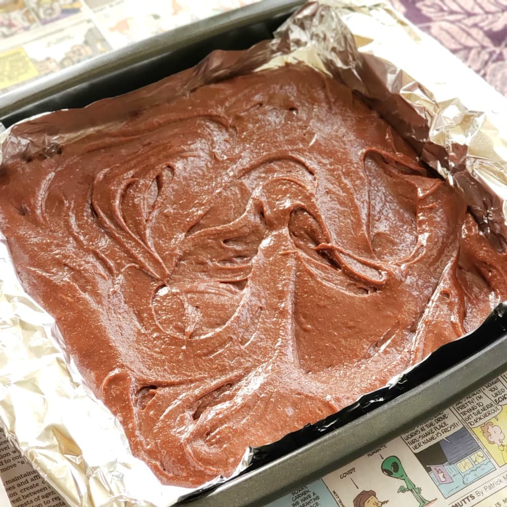 Spread Fudgy Chocolate Brownie batter into foil-lined pan
