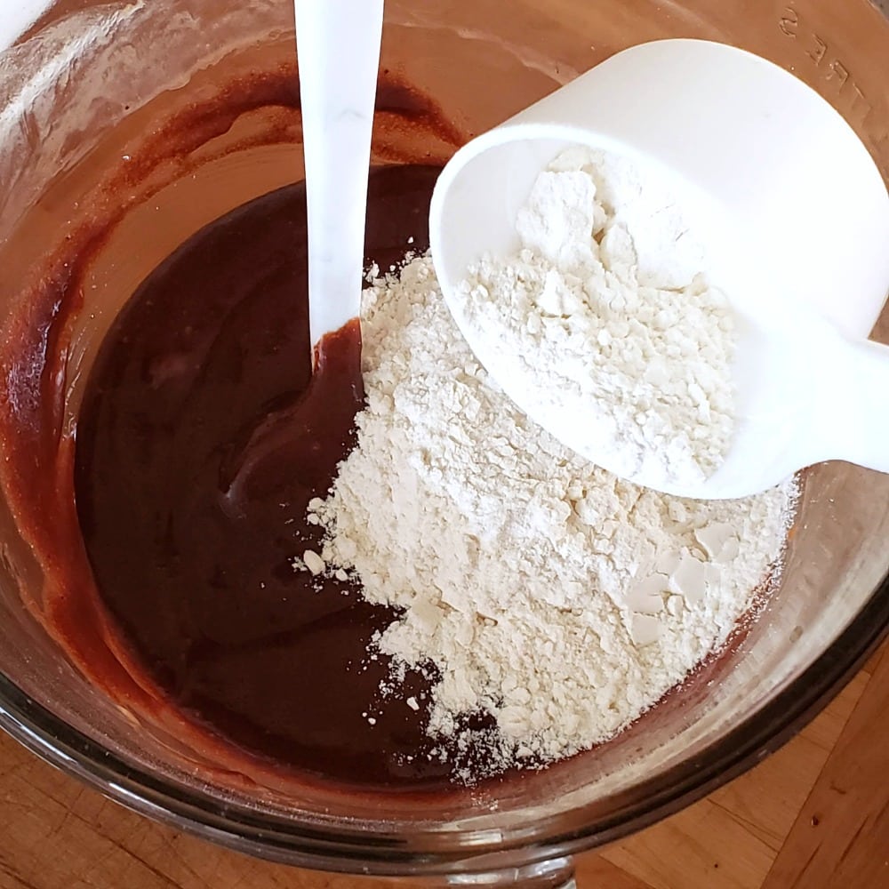 Adding flour to the batter