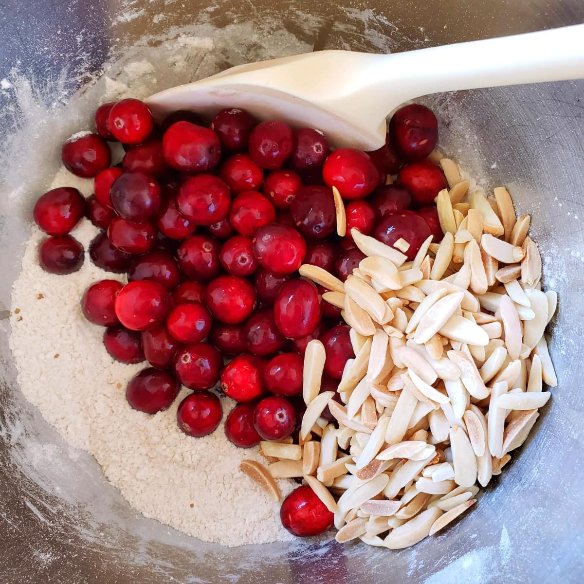 Cranberries and almonds go into the cake