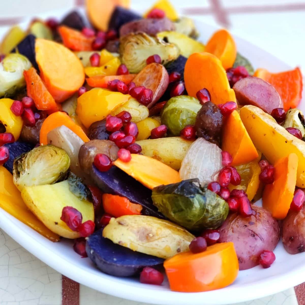 Roasted Rainbow Vegetables take the simplest, most delicious, seasonal vegetables and roast them quickly to perfection, for a colorful, healthy side dish or vegan main dish.