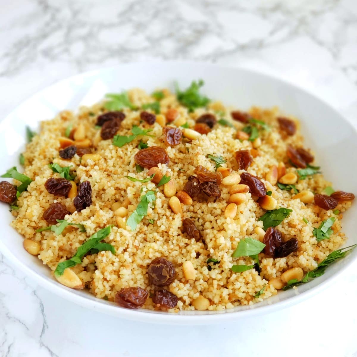 Golden raisins on top of couscous