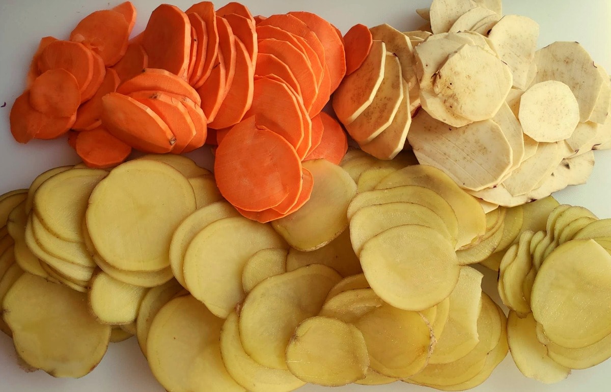 Sliced potatoes on a cutting board