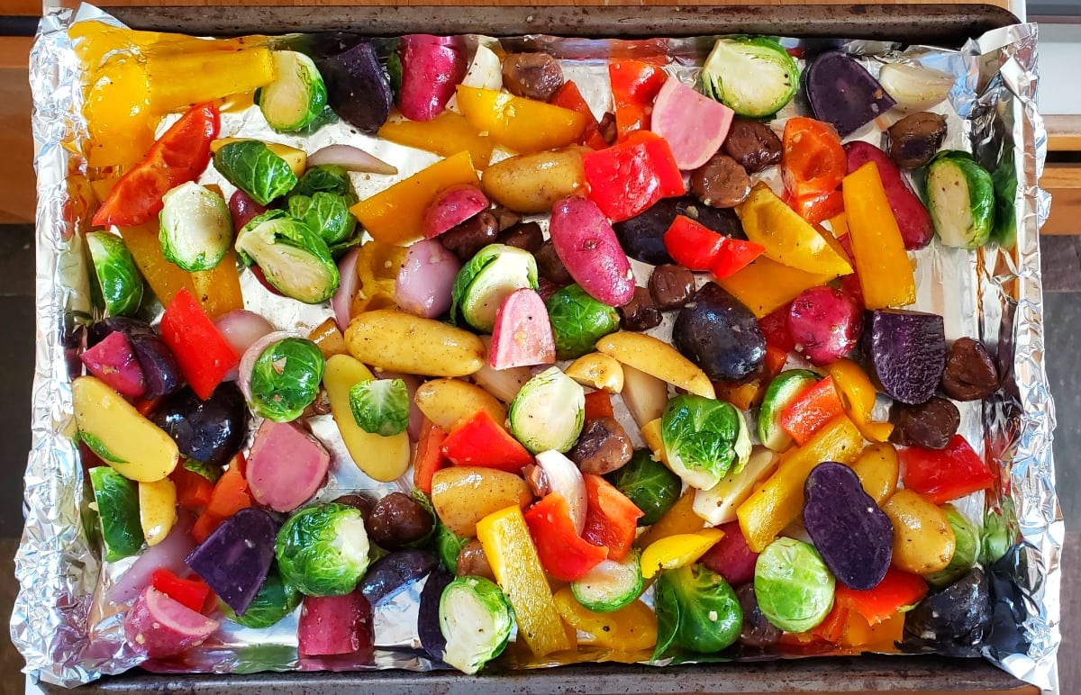 Vegetables go onto a foil-lined baking sheet