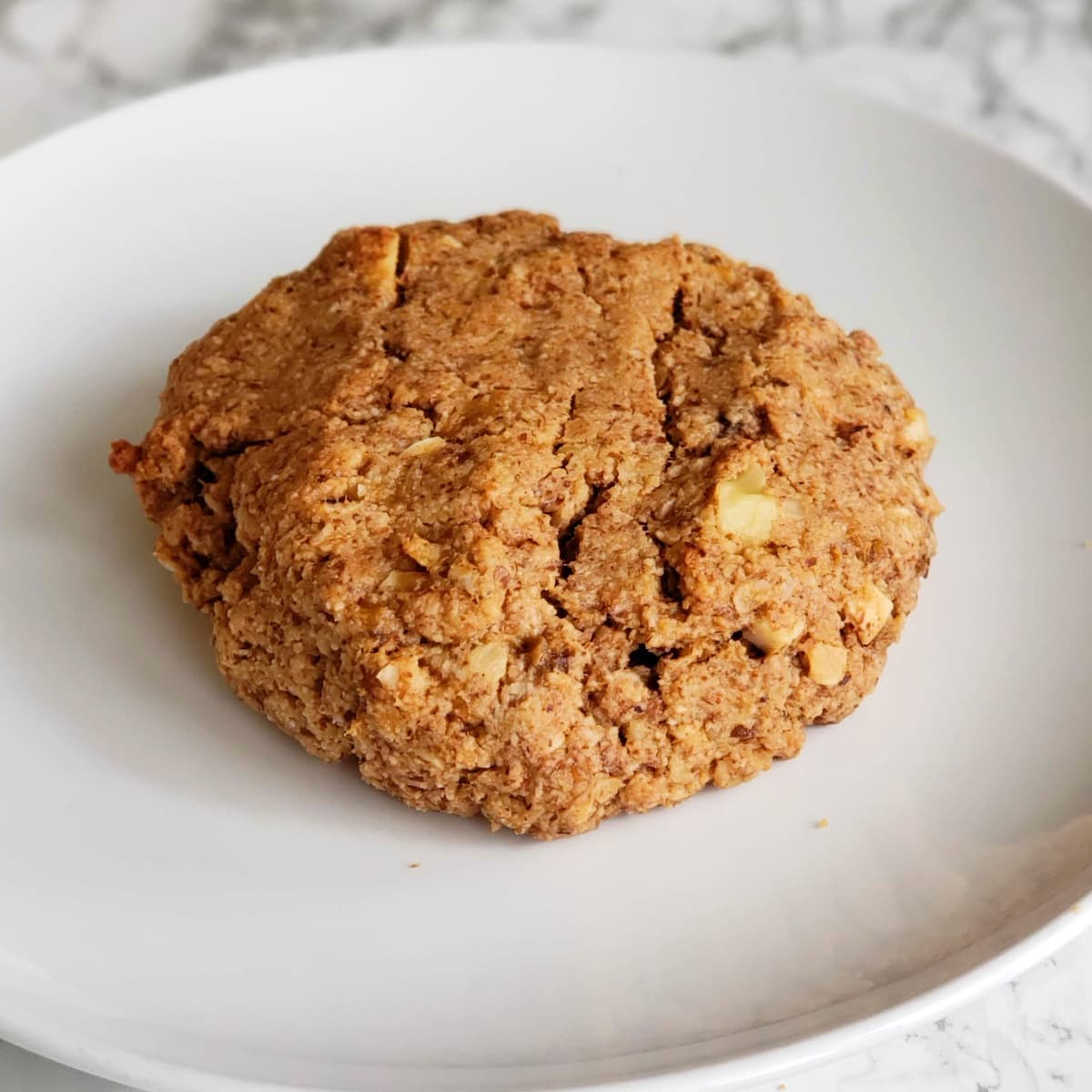 Roasted Banana Almond Butter Breakfast Cookie on a white plate on ShockinglyDelicious.com