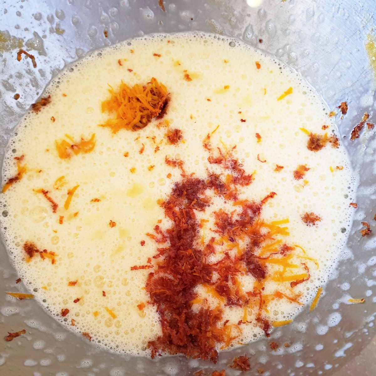 Adding orange and lemon zest to the cake batter