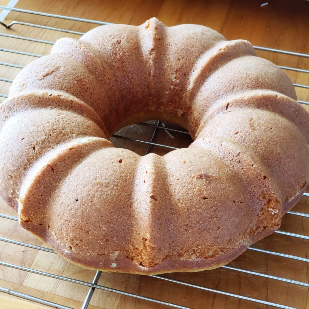 Cake cooling on a rack on ShockinglyDelicious.com