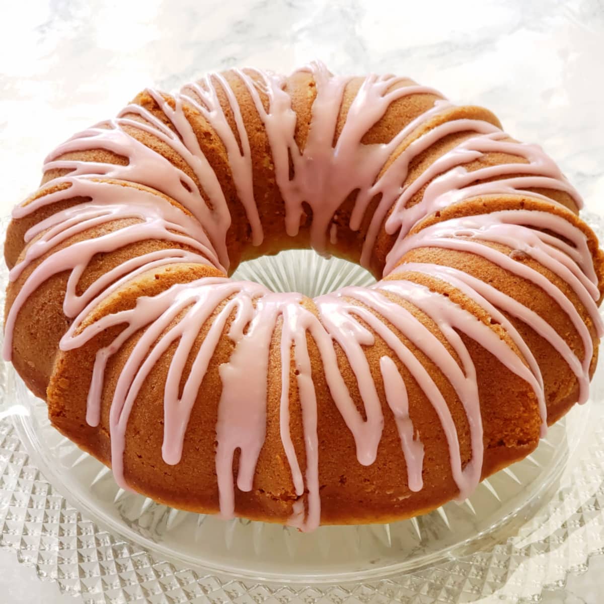 Italian Blood Orange Olive Oil Bundt Cake on a glass cake stand