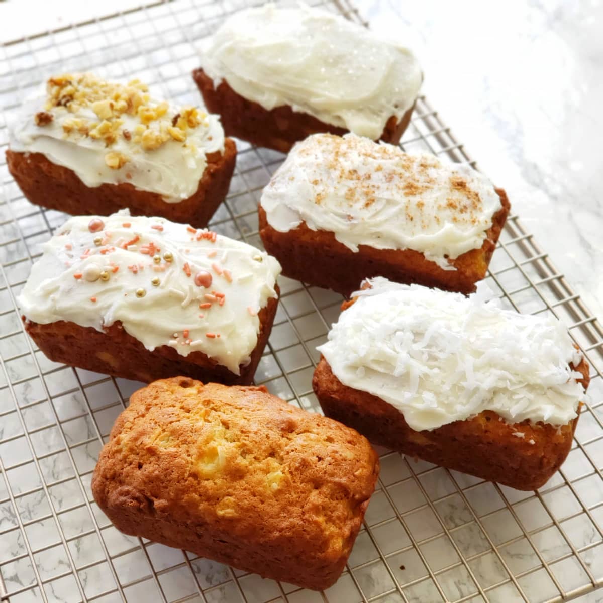 6 loaves of Pineapple Coconut Quick Bread baked and iced 