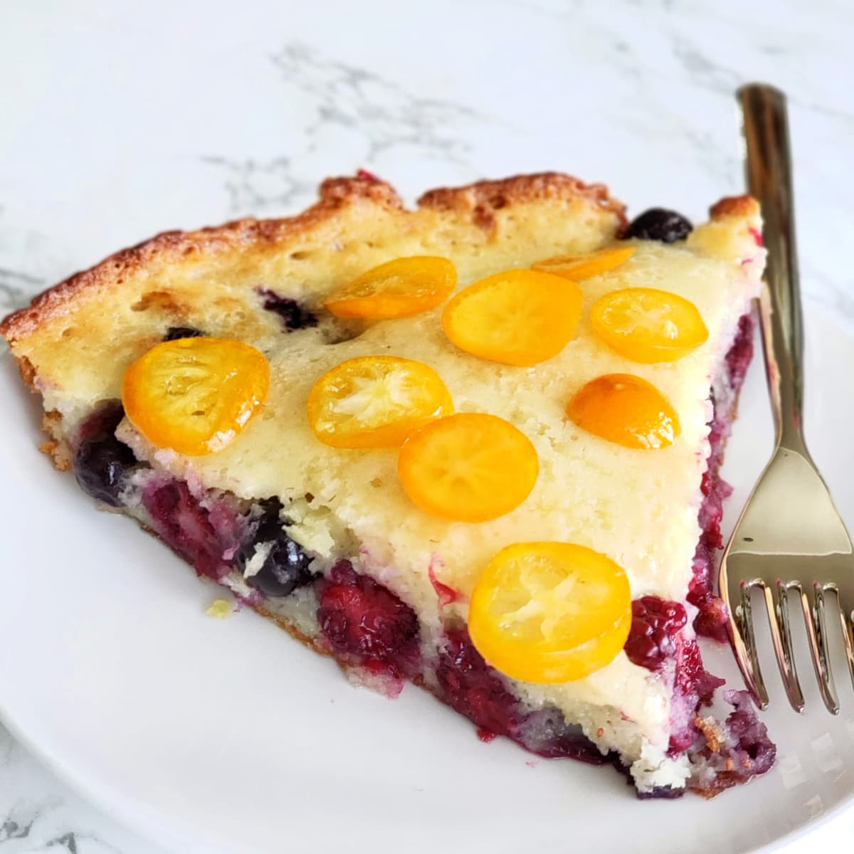 Berry Pancake wedge with candied kumquat slices on top