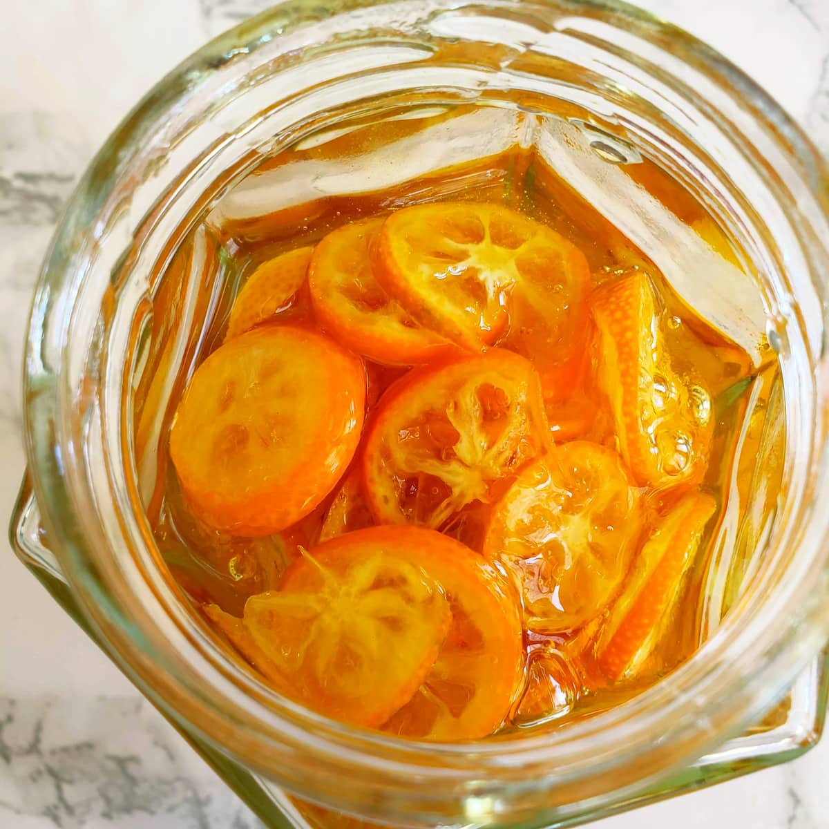 Honey and kumquats in a jar