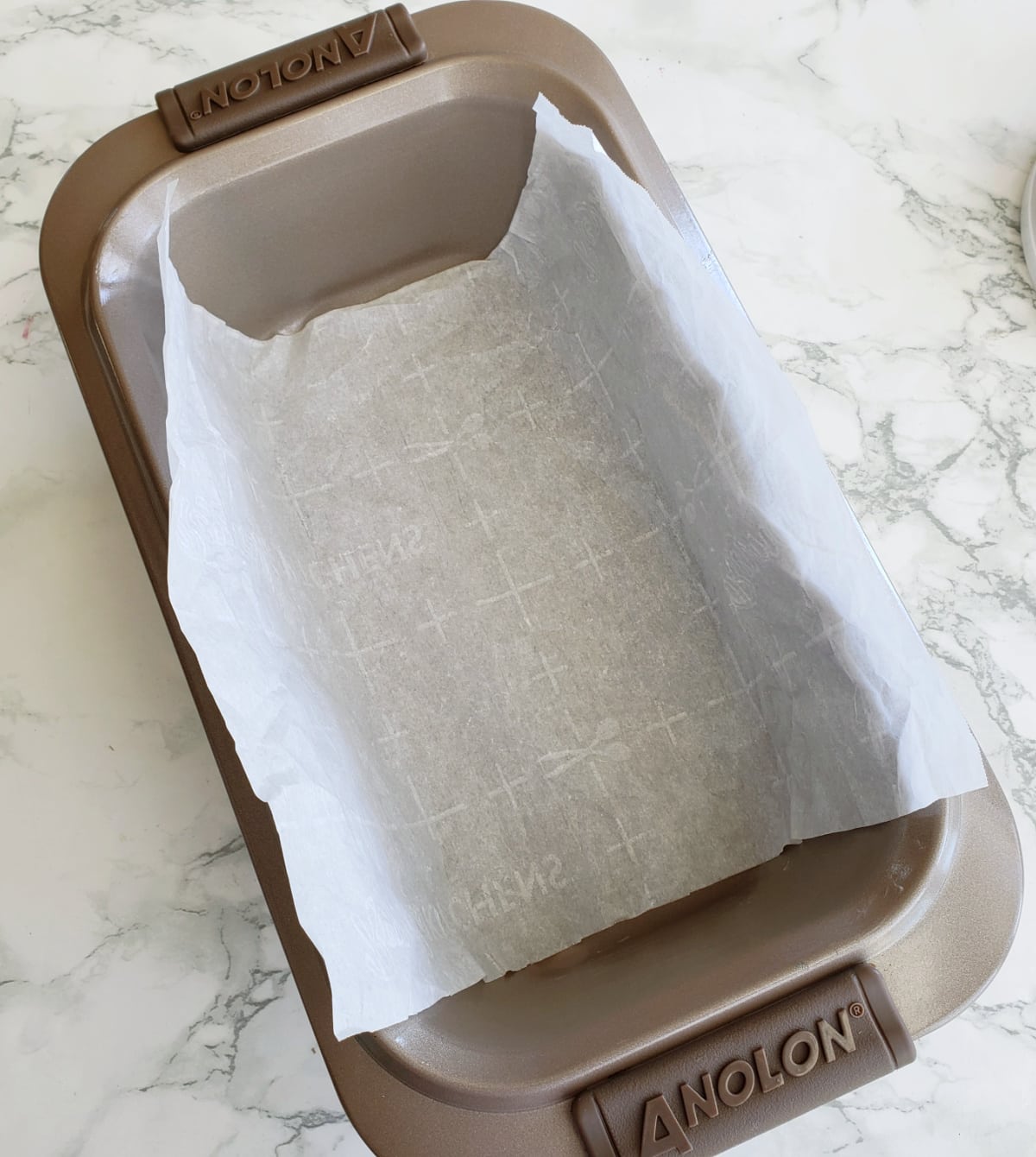 Line the loaf pan with parchment paper