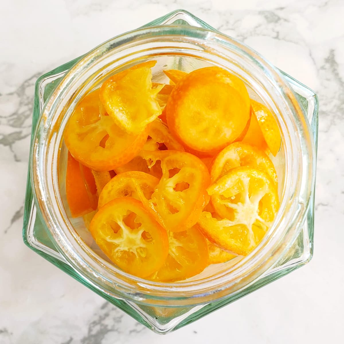 Sliced kumquats in a jar