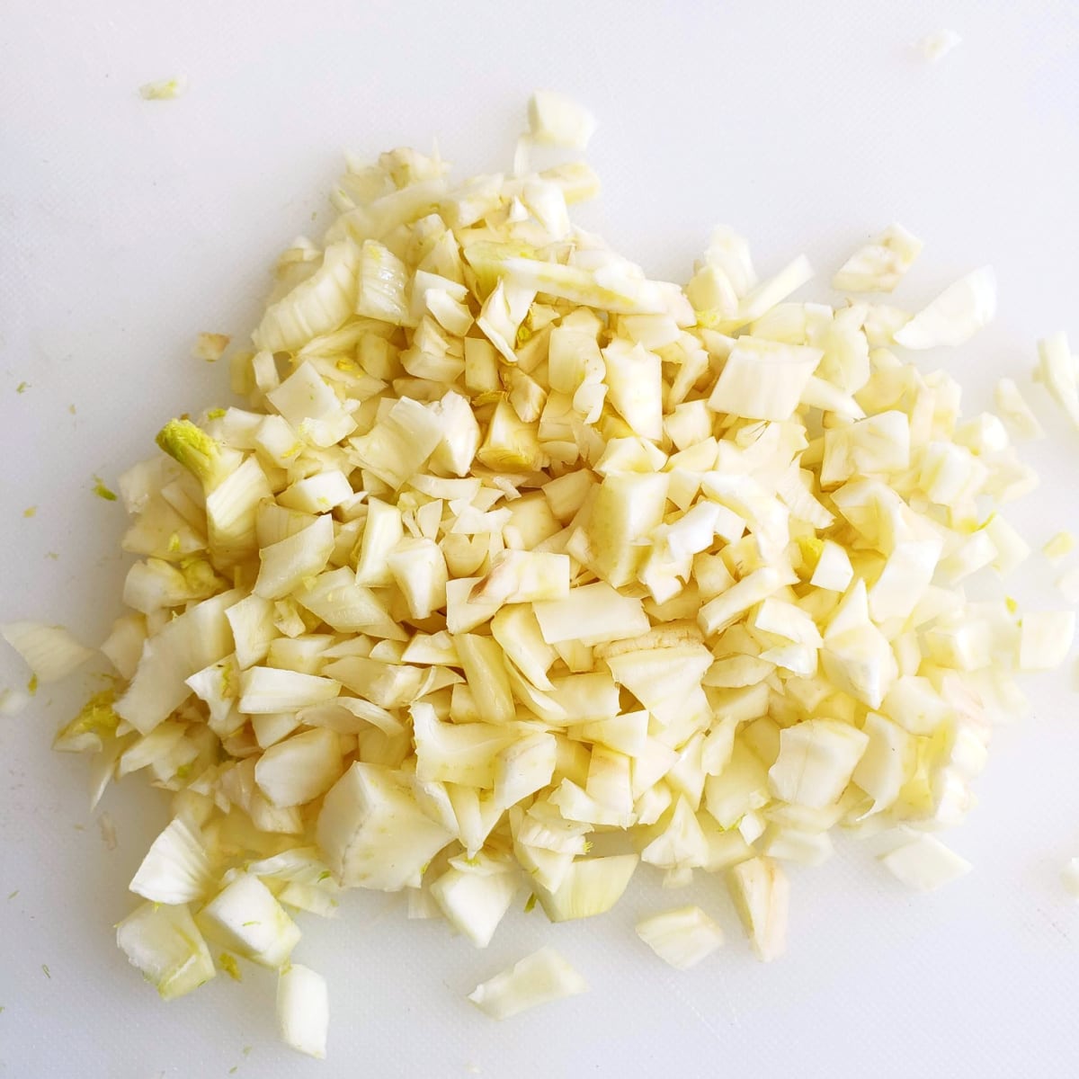 Dice the fennel on a white cutting board