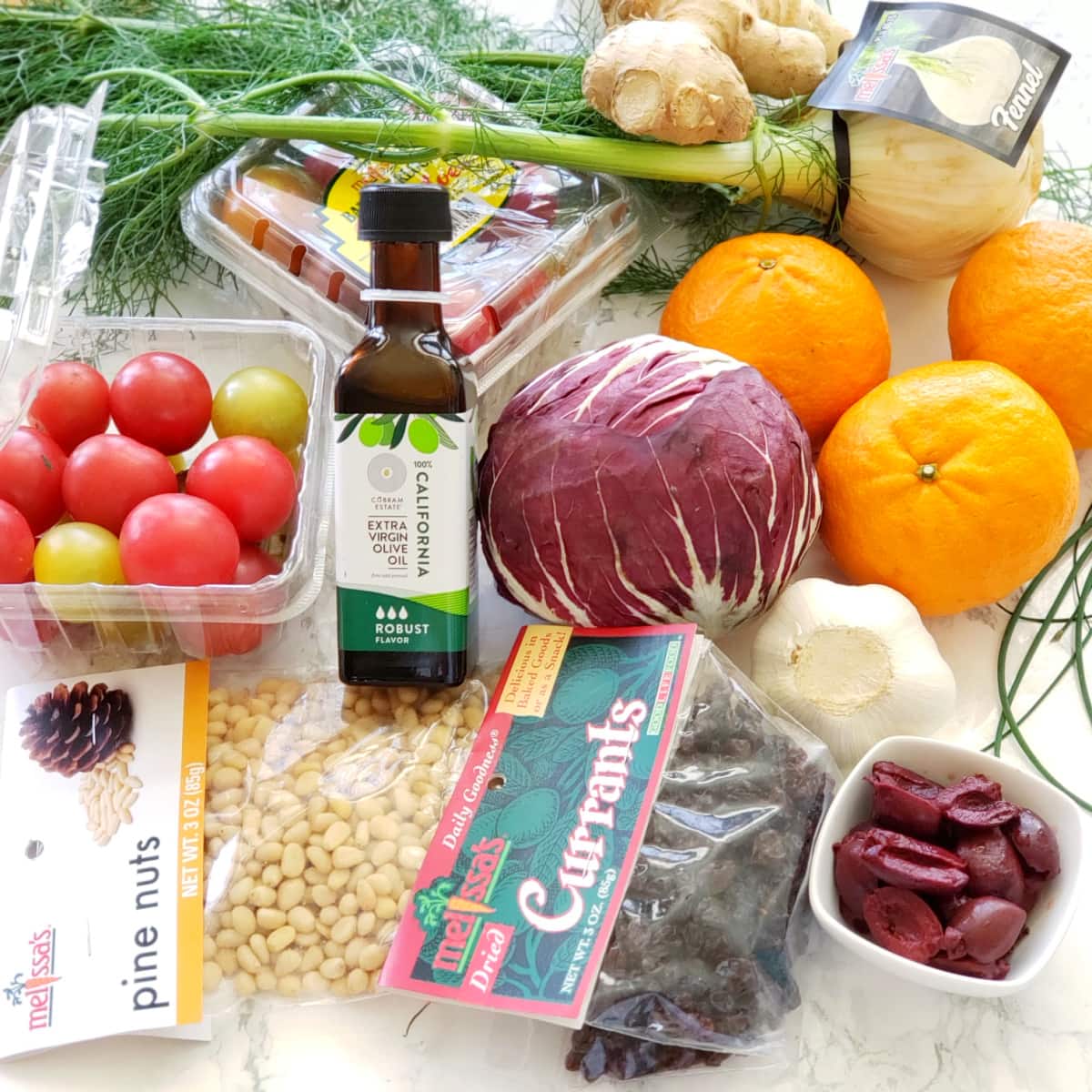 Ingredients for Pasta with Fresh Tomatoes and Tangerines on a marble counter