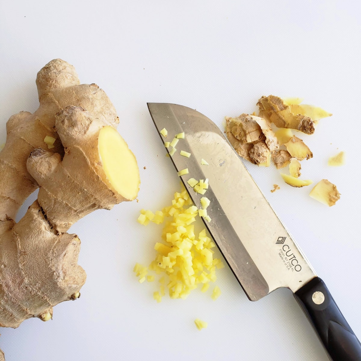 Peel the ginger skin off and finely mince it with a knife on a white cutting board