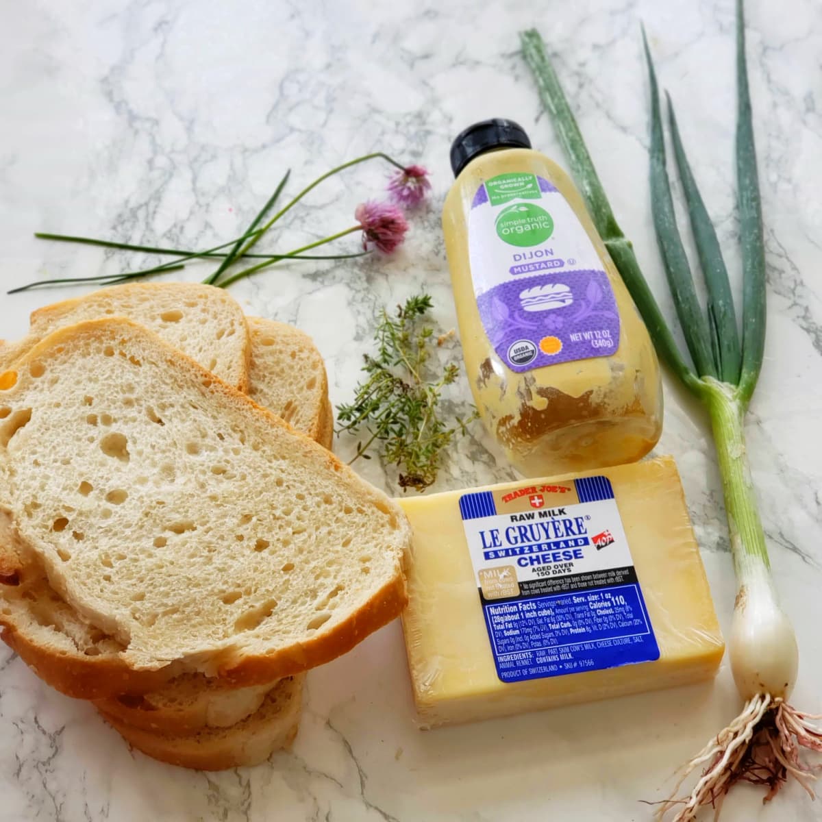 Ingredients for French Onion Open Faced Sandwich on a white counter on ShockinglyDelicious.com