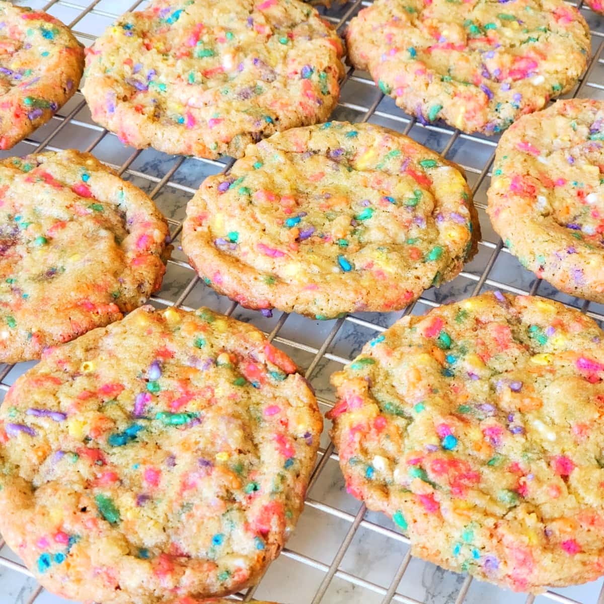 8 Confetti Sprinkle Cookies cooling on a baking rack