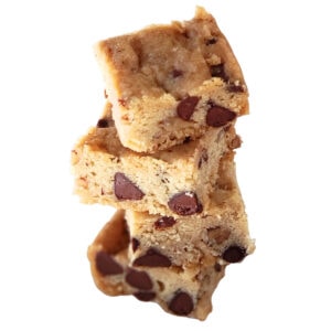 4 Chococlate Chip Pecan Shortbread Cookies stacked on top of each other with a white background