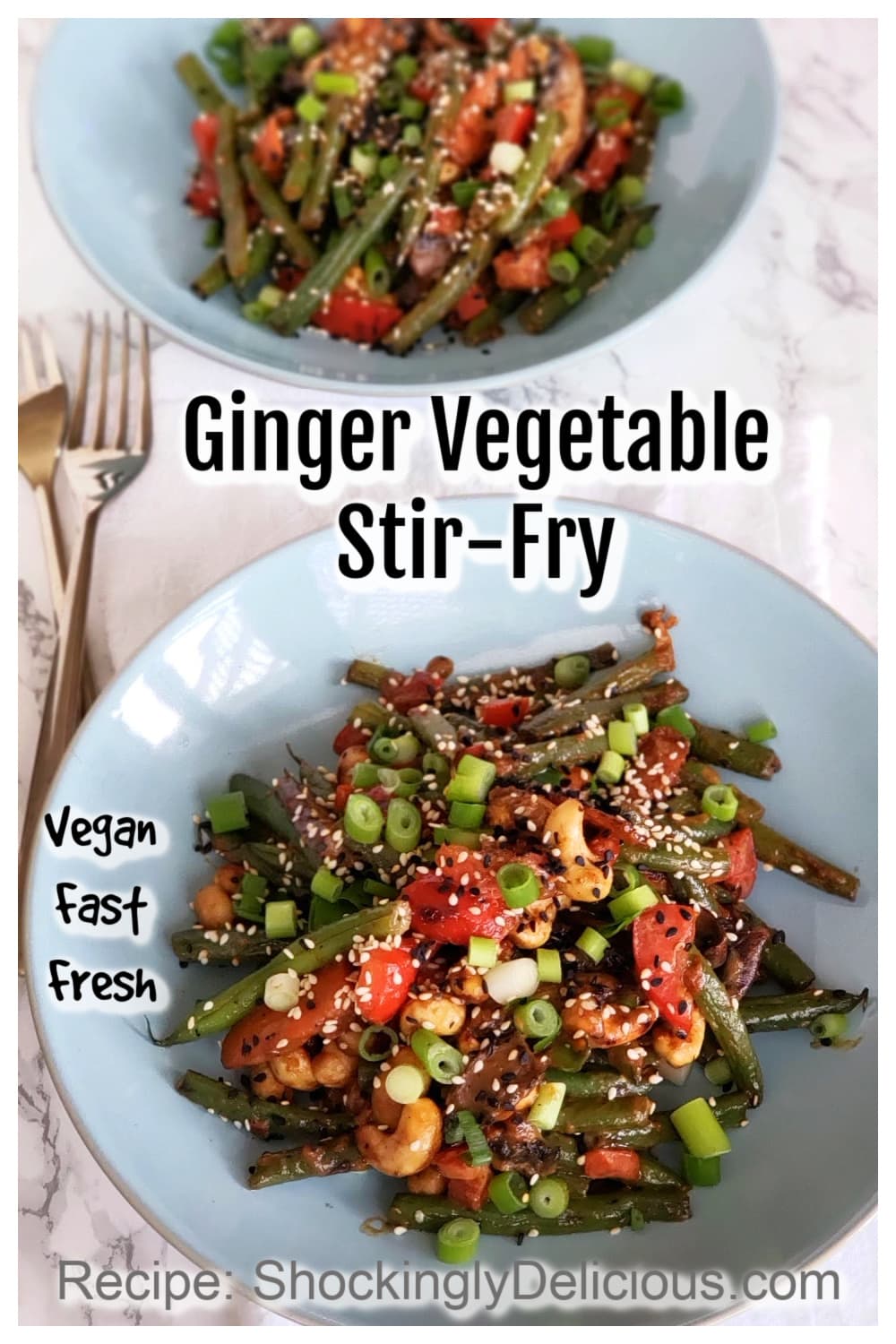 2 light blue bowls of Ginger Vegetable Stir-Fry on a white marble counter top with 2 forks along left side