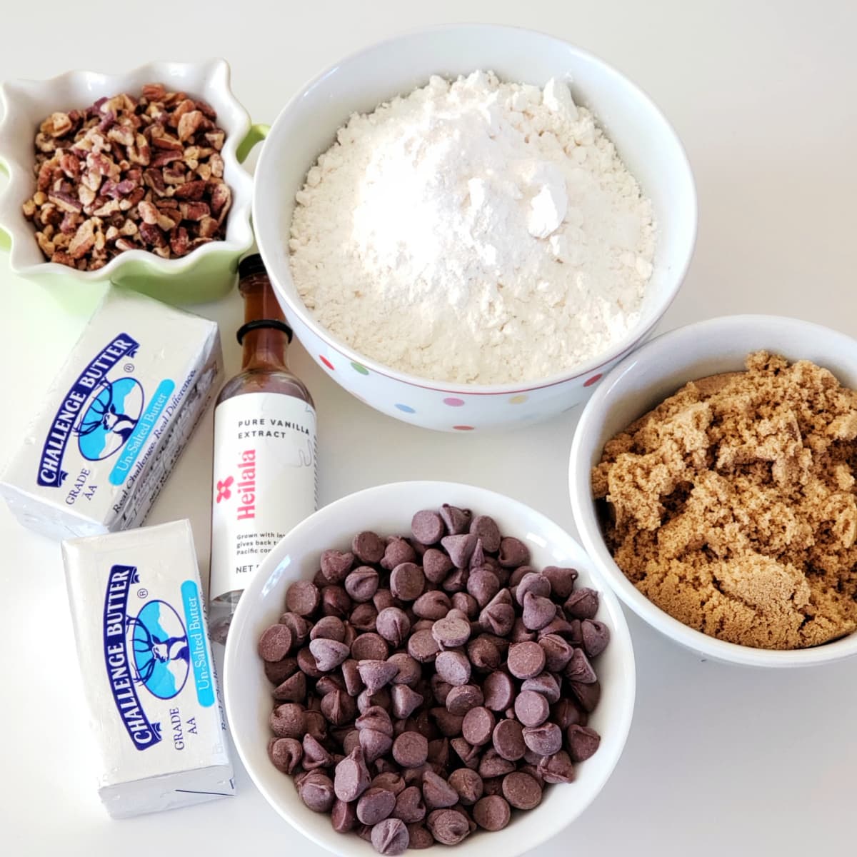 Ingredients for cookies arranged on a white counter top