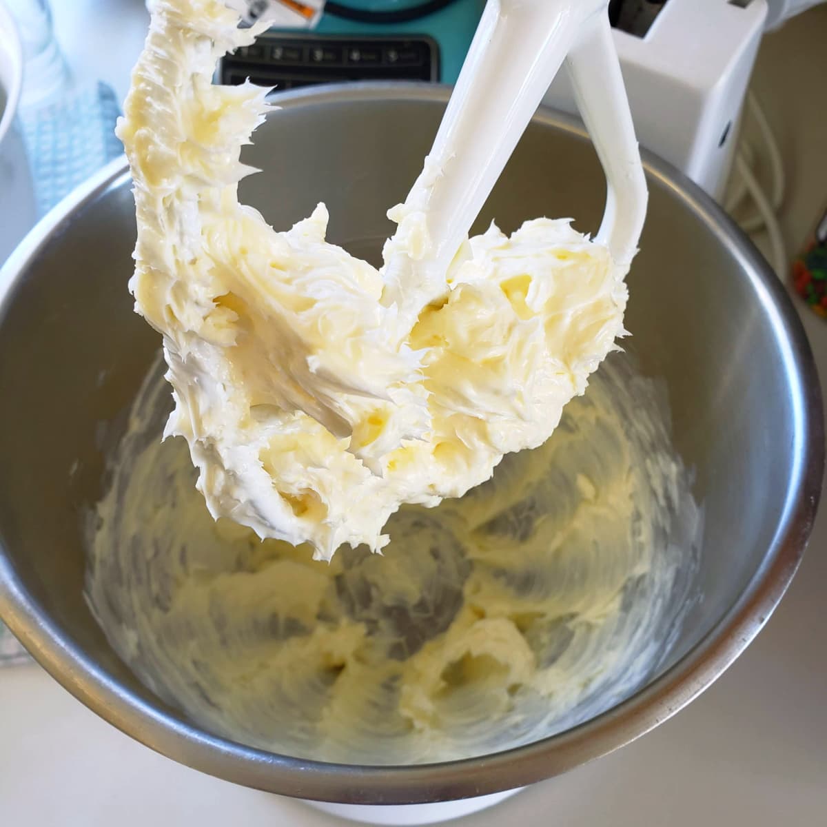 Whipped butter on the paddle of an electric mixer