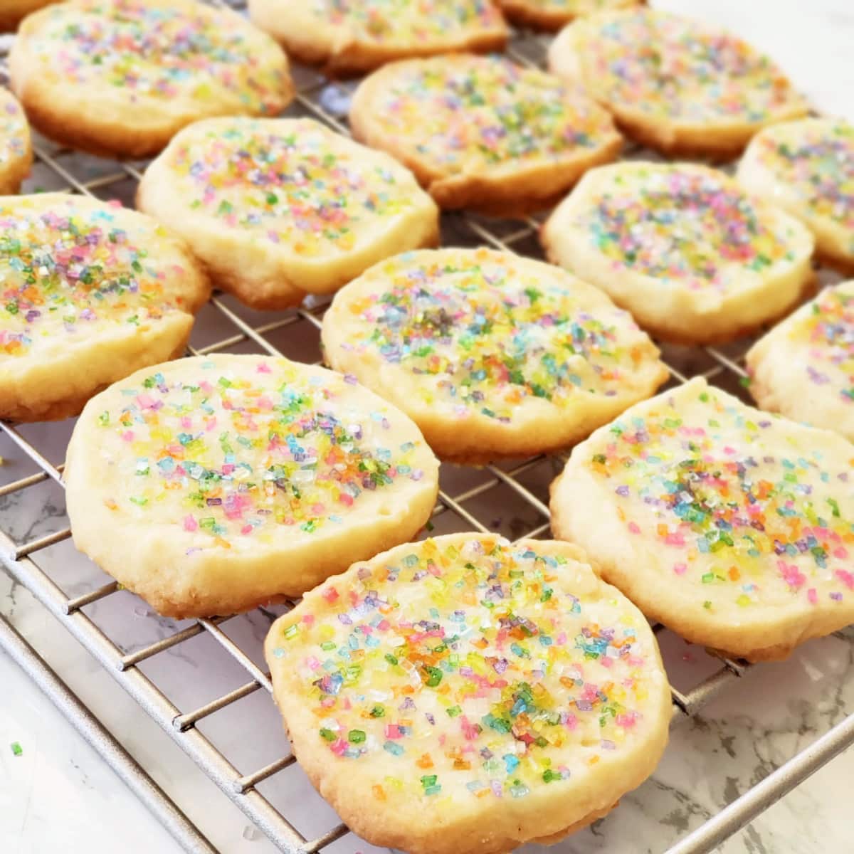 Coconut Lime Shortbread cookies on a wire cooling rack