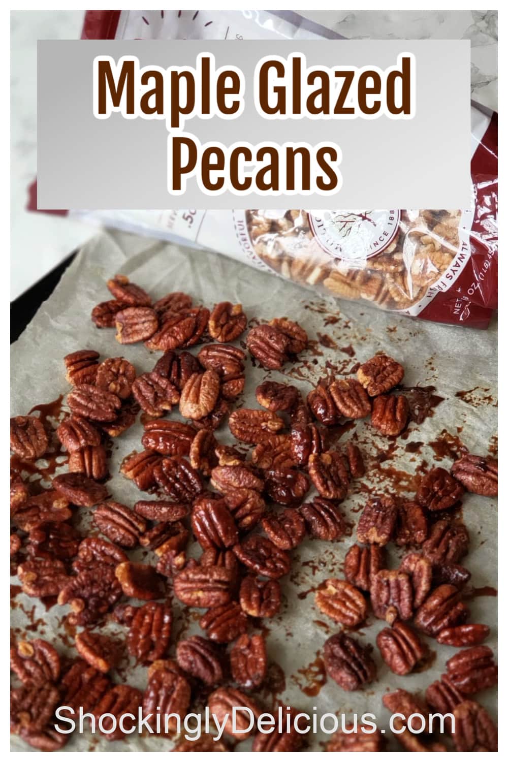 Pecans on parchment paper on a baking sheet, with the recipe title superimposed on top 