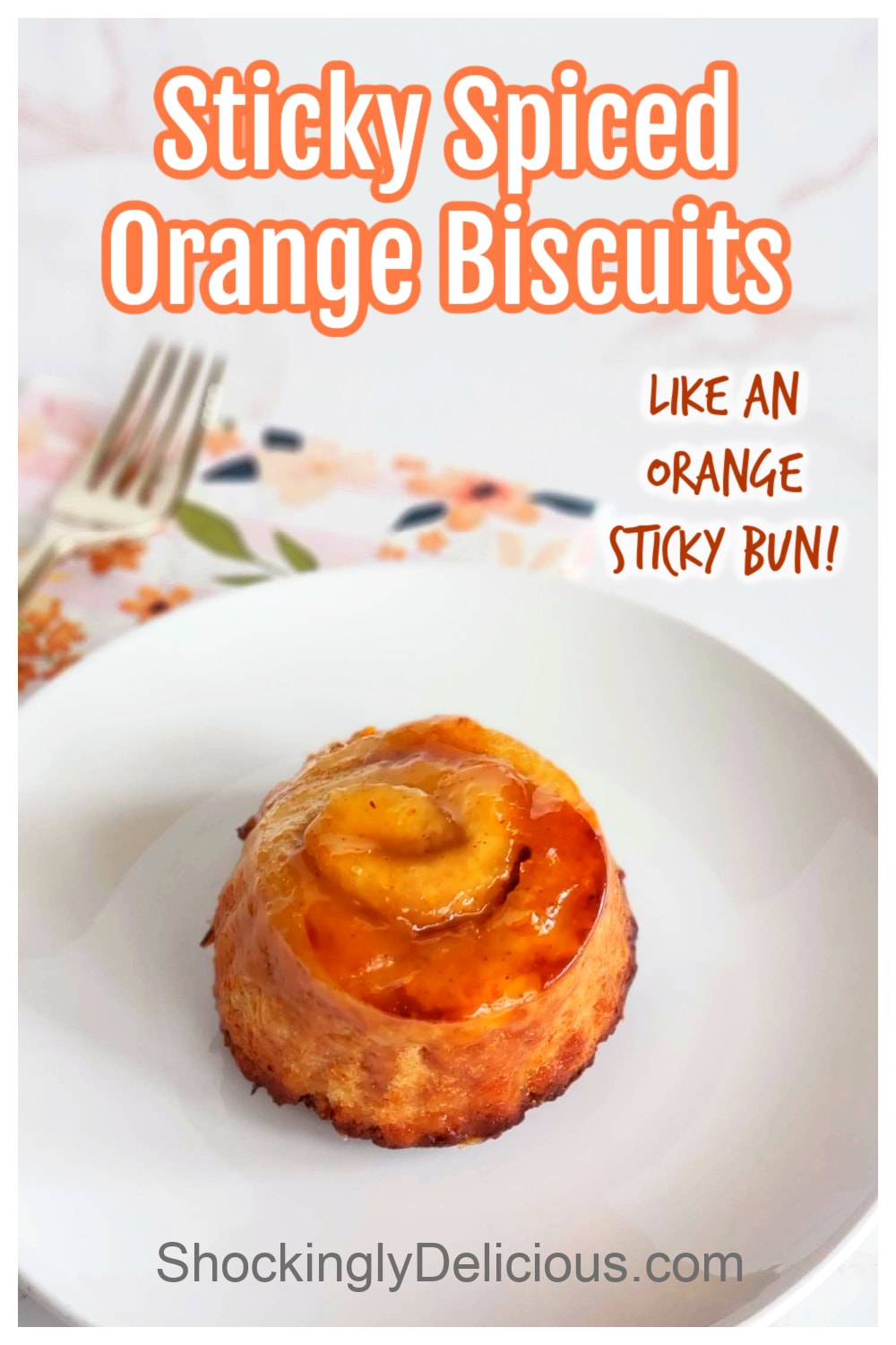 A single orange biscuit on a white plate with recipe title above