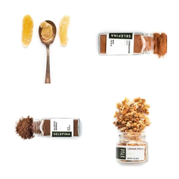 3 spice jars and a spoon with candied ginger on it